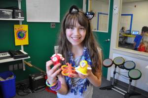 Girl shows off Claymation at Empow Studios