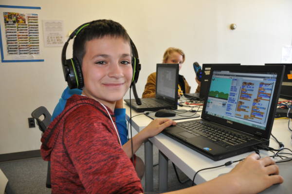 Boy coding in Scratch at Empow Studios