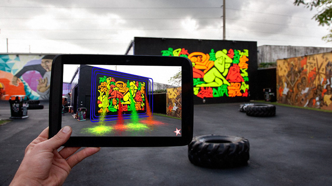 A mural in Miami, painted by Ryan McGinnis and animated by digital artist B.C. Biermann, is an example of how augmented reality has been altering the art world and urban landscapes. Museums and classrooms are also incorporating this technology. Photo Credit: www.fastcocreate.com