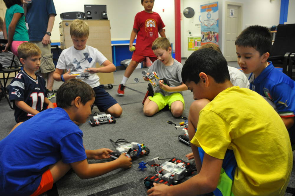 children playing with robots at Empow Studios