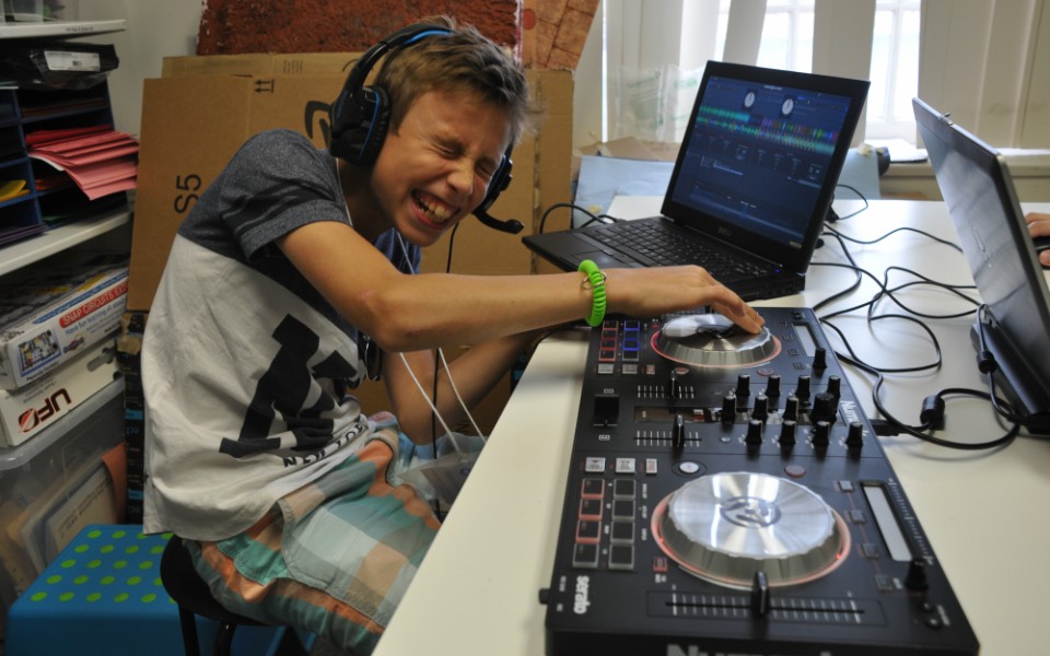 Student playing with DJ curriculum