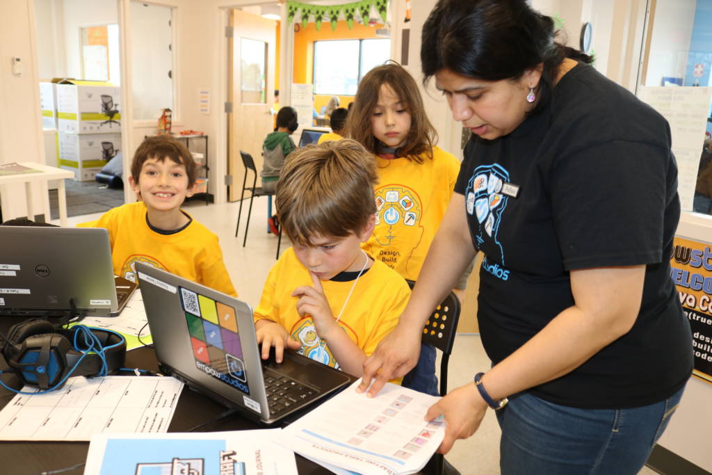 Empow Teacher works with students on an Artificial Intelligence (AI) project