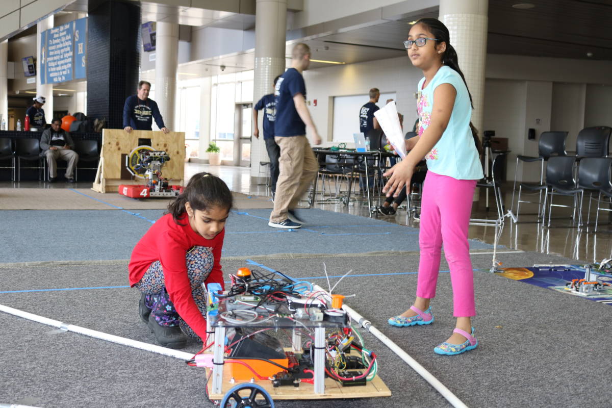 Kids test and drive robot at Shrewsbury Robotics Open House
