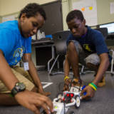 Campers collaborate on building and programming a robot!